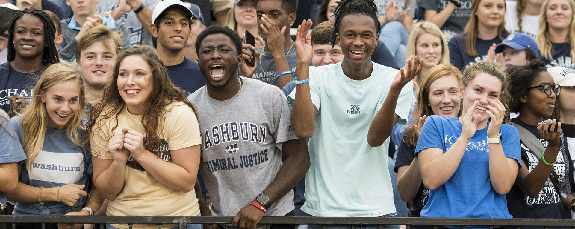 Students cheer during a Washburn football game