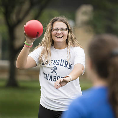 A student smiles while at an event on campus