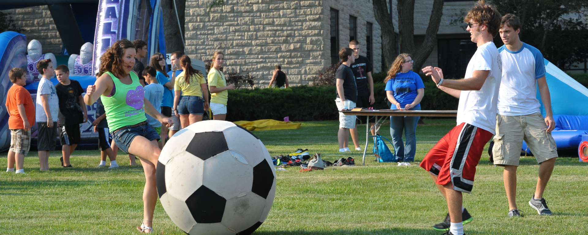Students and children playing games on the Union Lawn