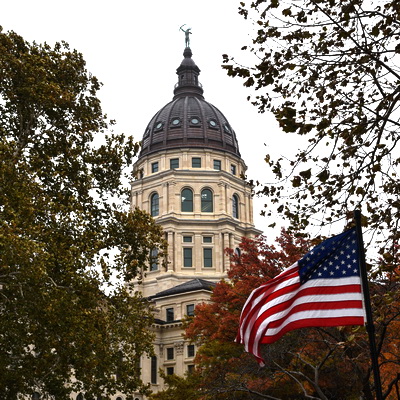 Topeka capital building with USA flag