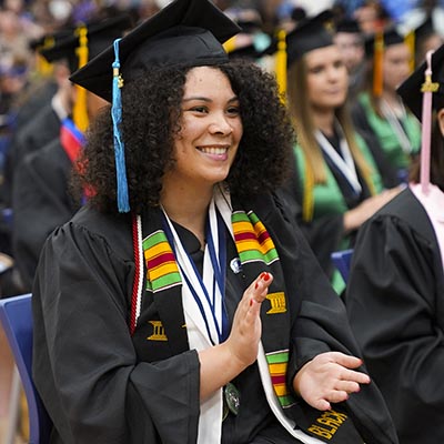 A student claps during the ceremony