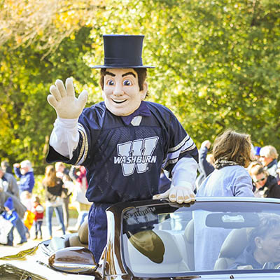 Ichabod mascot waves in the homecoming parade