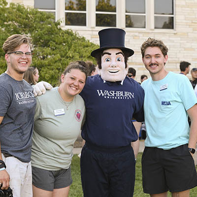 Students pose for a photo with Mr. Ichabod.