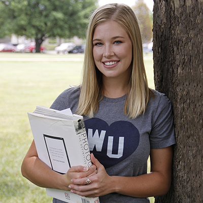 A Washburn student reads her tablet in the Memorial Union.