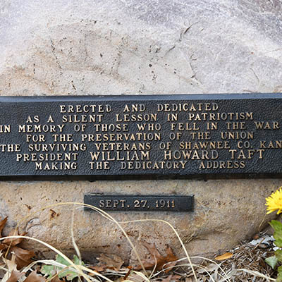 Flag pole memorial plaque.