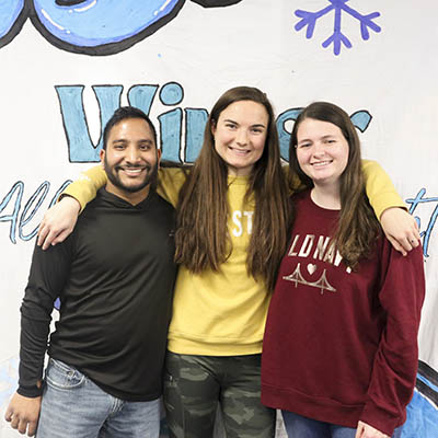 A group of leadership students smile and pose for a photo.