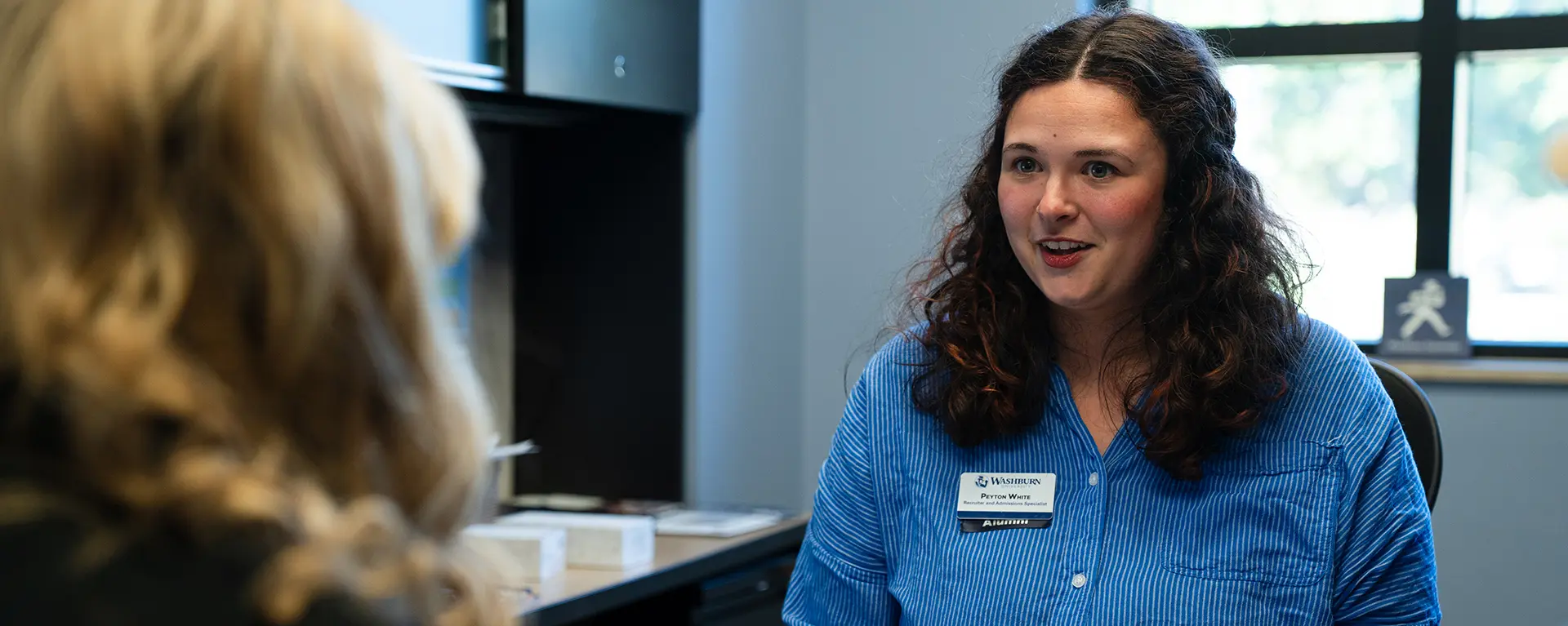 A Washburn admissions counselor meets with a prospective student.