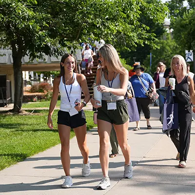 Students chat while walking to class.