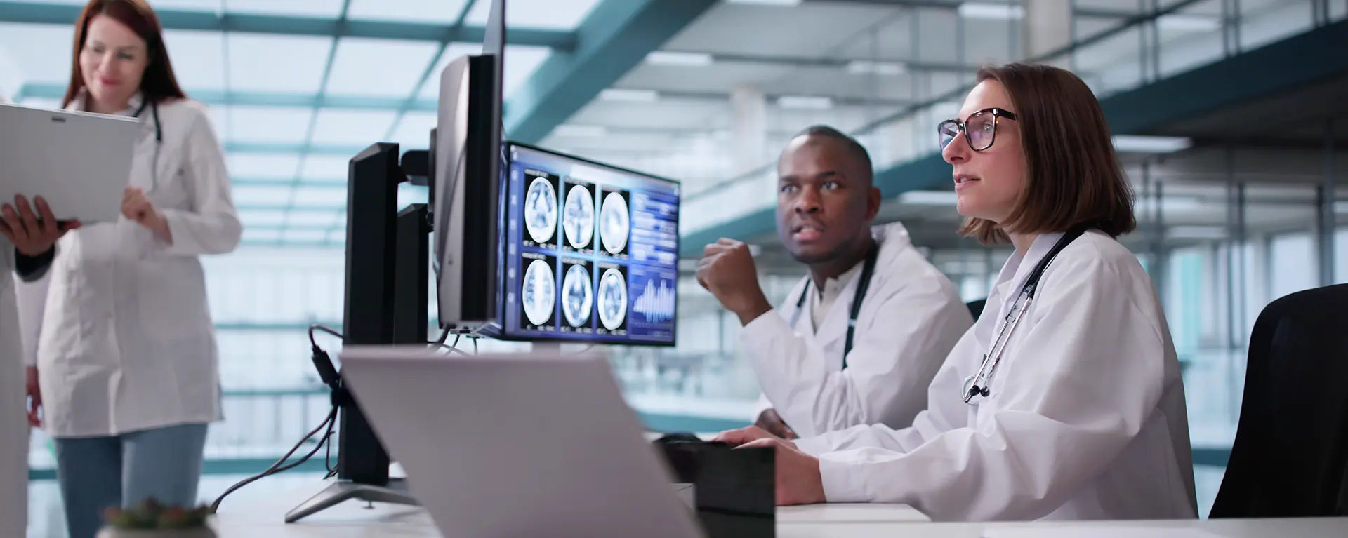 A medical dosimetrist looks at scan results.