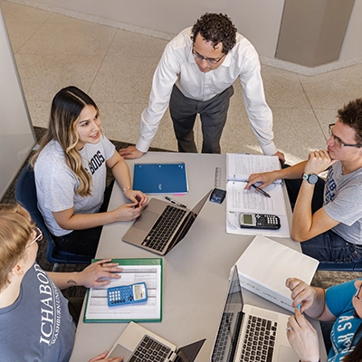 An overhead of a group of students studying at a table.