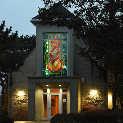 Carole Chapel illuminated at night.