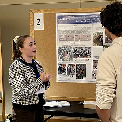 A student works at an archaeology site.