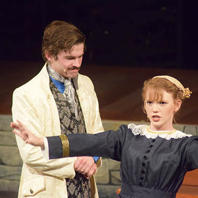 Lauren Province performing in a play on stage.