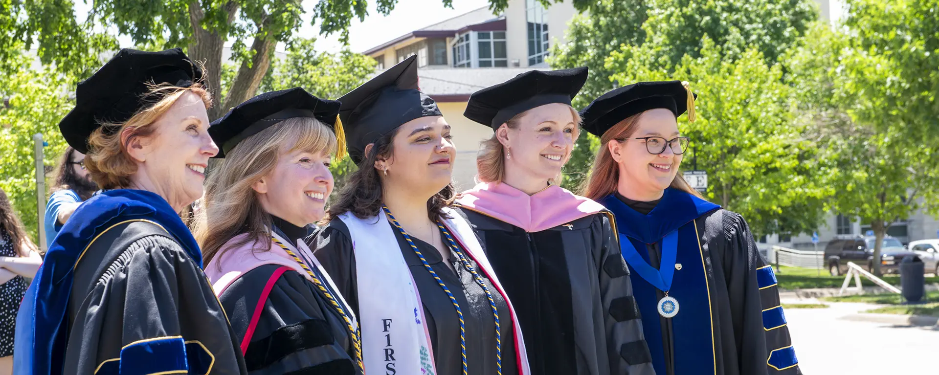 Music professors with a graduate.