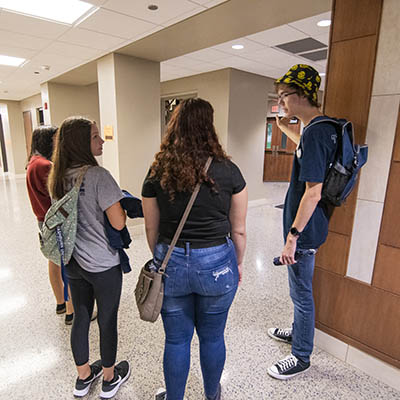 A student worker leads a tour.