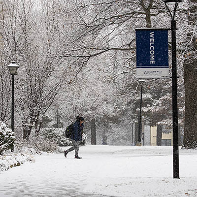 A student walks to class in the snow