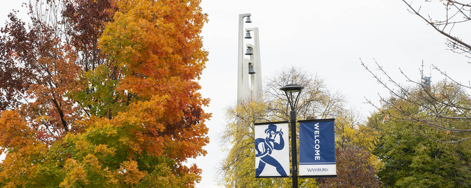 A Washburn student works on an assignment in the Welcome Center lobby.