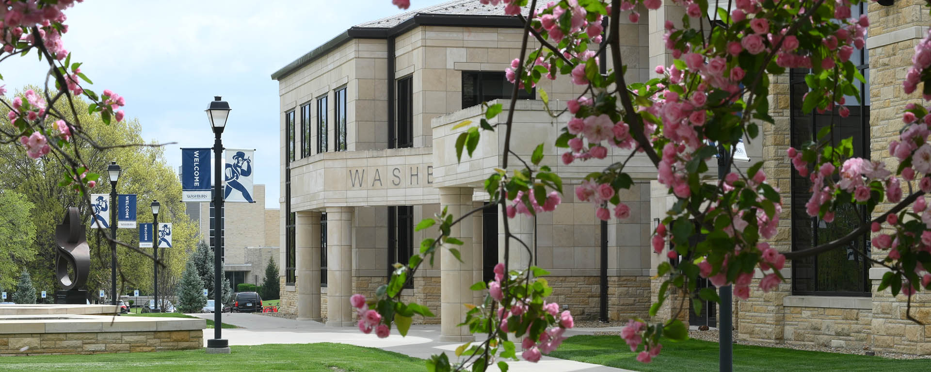 Morgan Hall with trees in bloom framing it