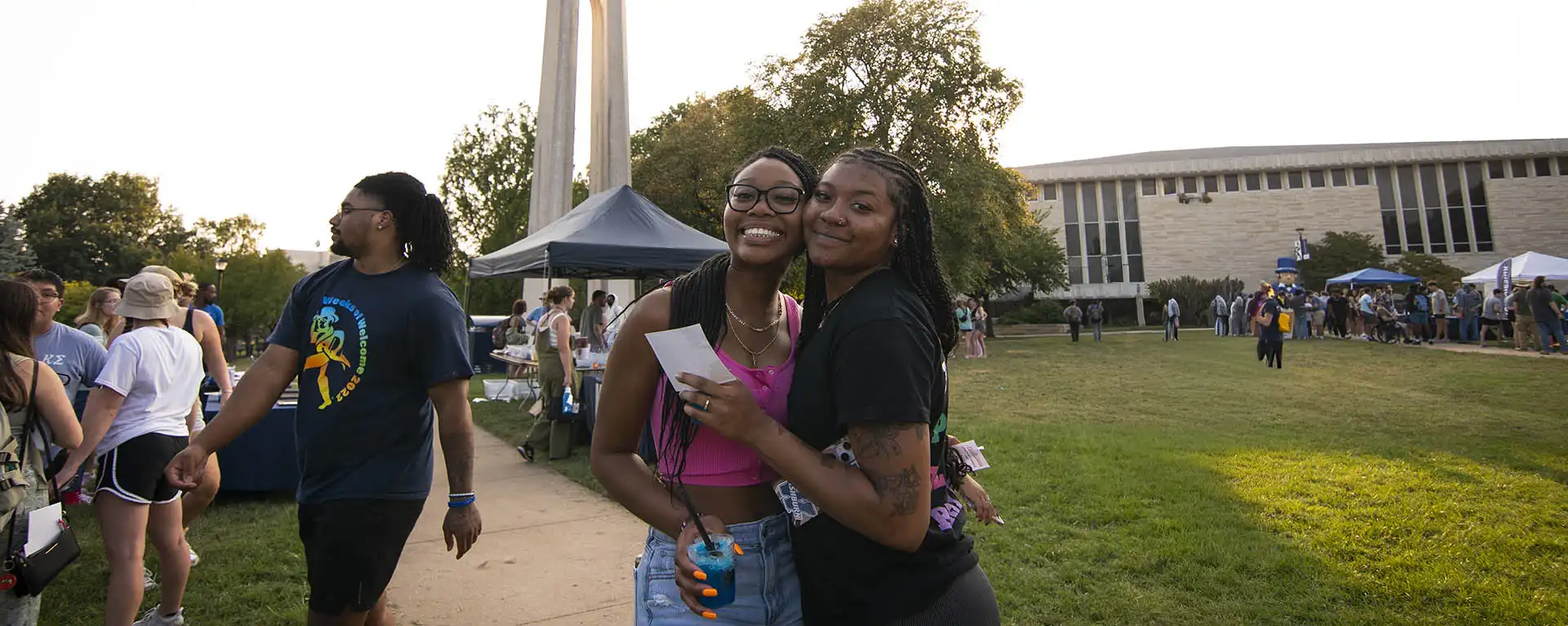 Two students take selfie at campus event