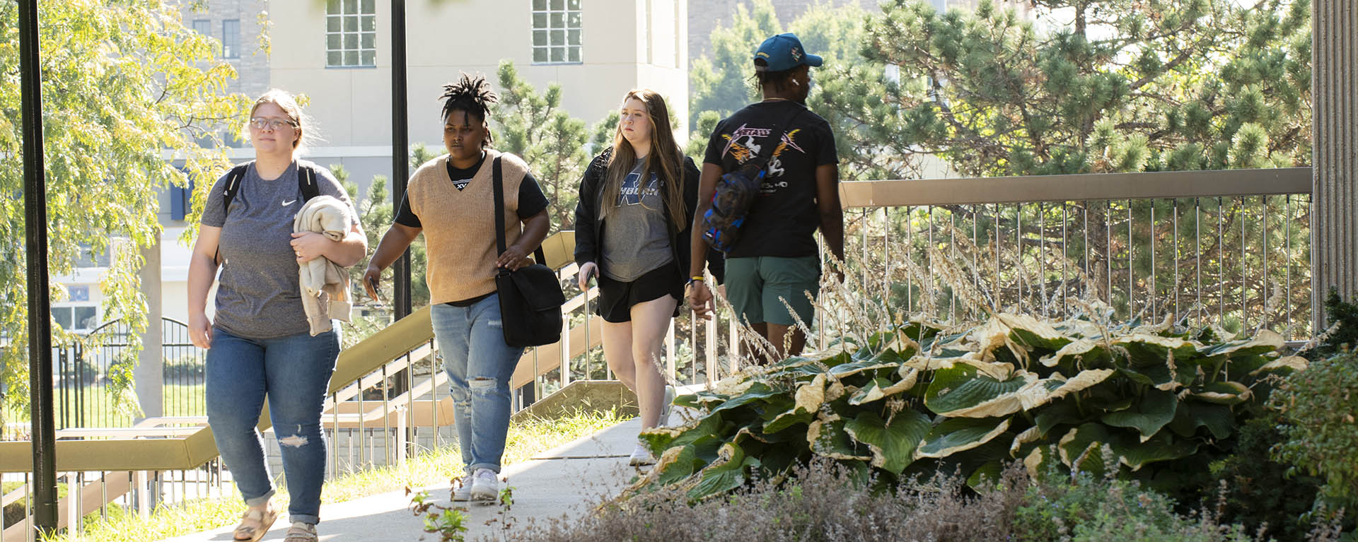 Students enter and exit the library.