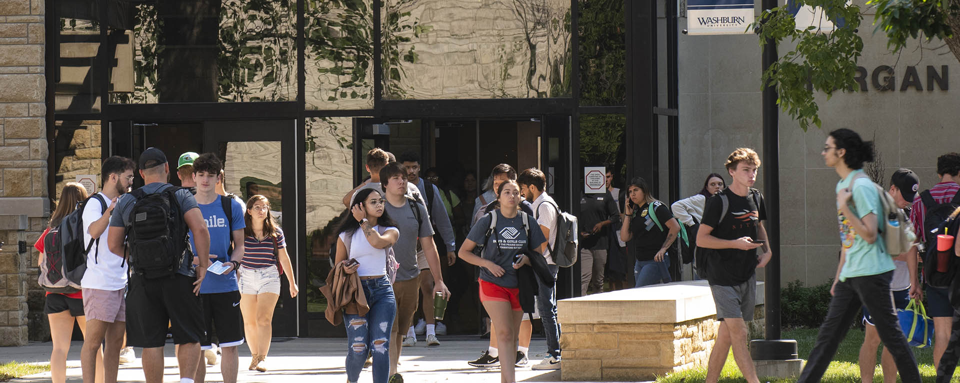 Students walking on campus outside of Morgan Hall.