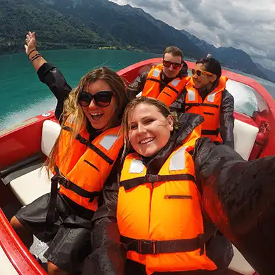 four students in Switzerland on boat ride
