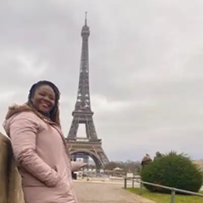 student in front of Eiffel Tower