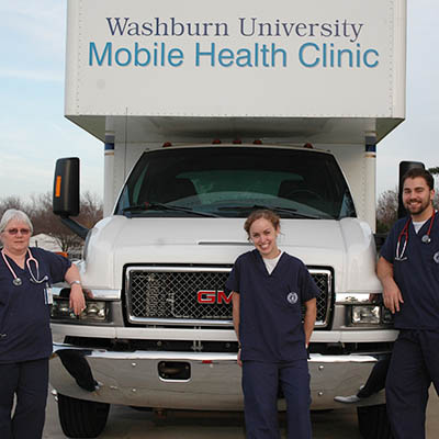 Washburn nursing students with the mobile health van.