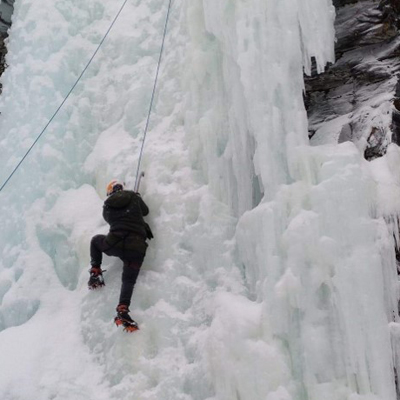 Ice-climbing a frozen waterfall in Lapland. I made it almost 3 meters up!