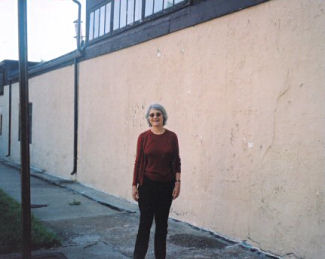 Carol Ascher in 2004 across the street from her childhood home.