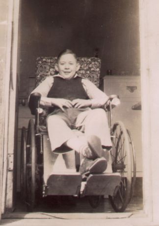 Max Yoho indoors in wheelchair